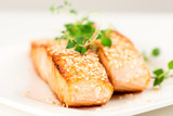 Grilled salmon on white plate selective focus