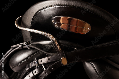 Black leather premium dressage saddle isolated. close up