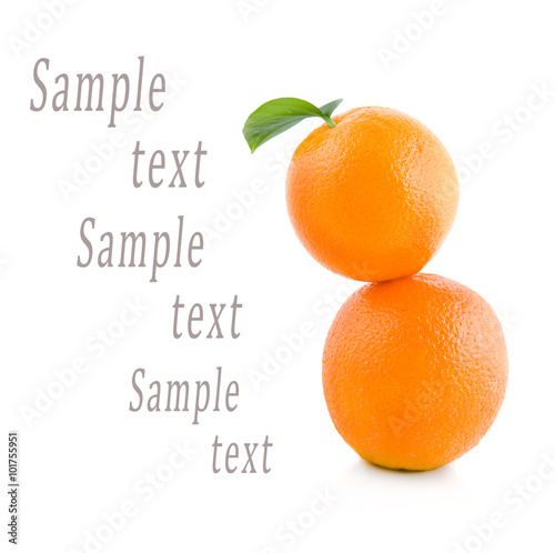 two oranges stand on each other on a white background