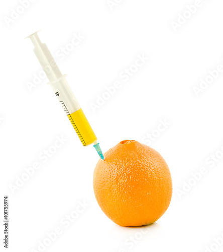  syringe is stuck in orange on a white background