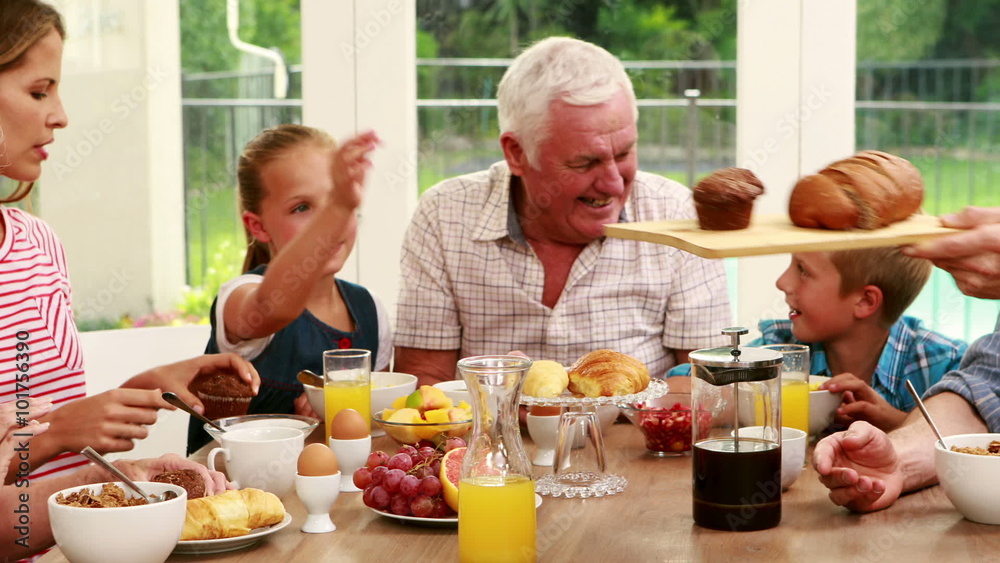 Happy family having breakfast together