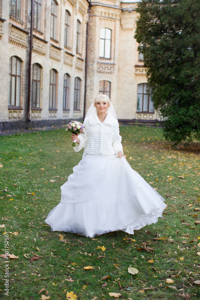 Blonde bride in white dress