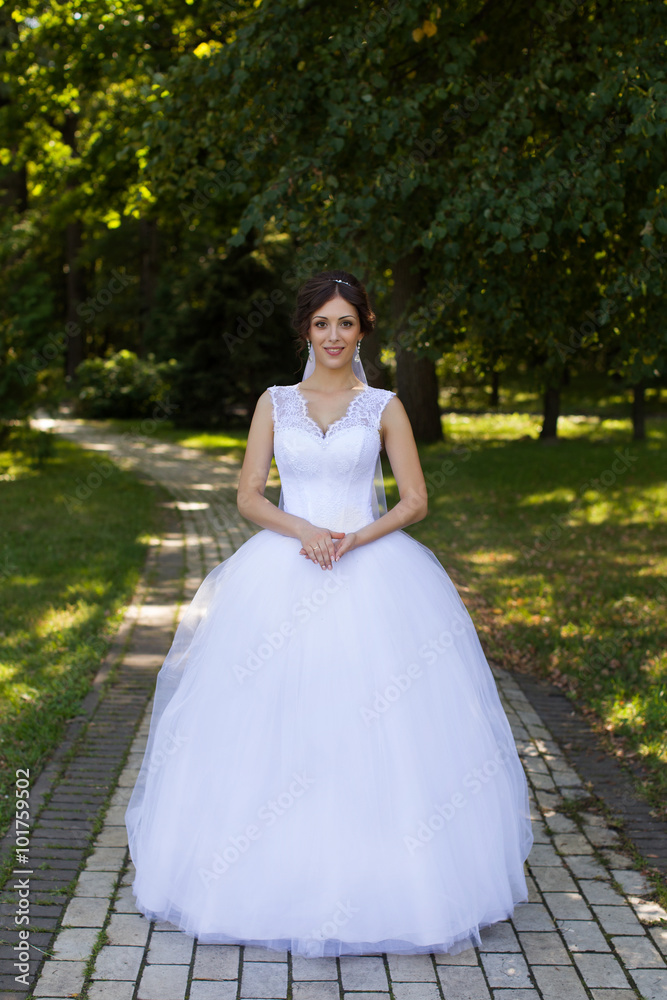 Bride with beautiful eyes at a wedding a walk in the woods