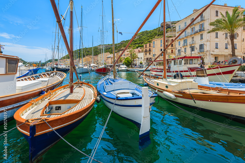 Traditional fishing boats in Bonifacio port on sunny summer day, Corsica island, France Traditional fishing boats in Bonifacio port on sunny summer day, Corsica island, France