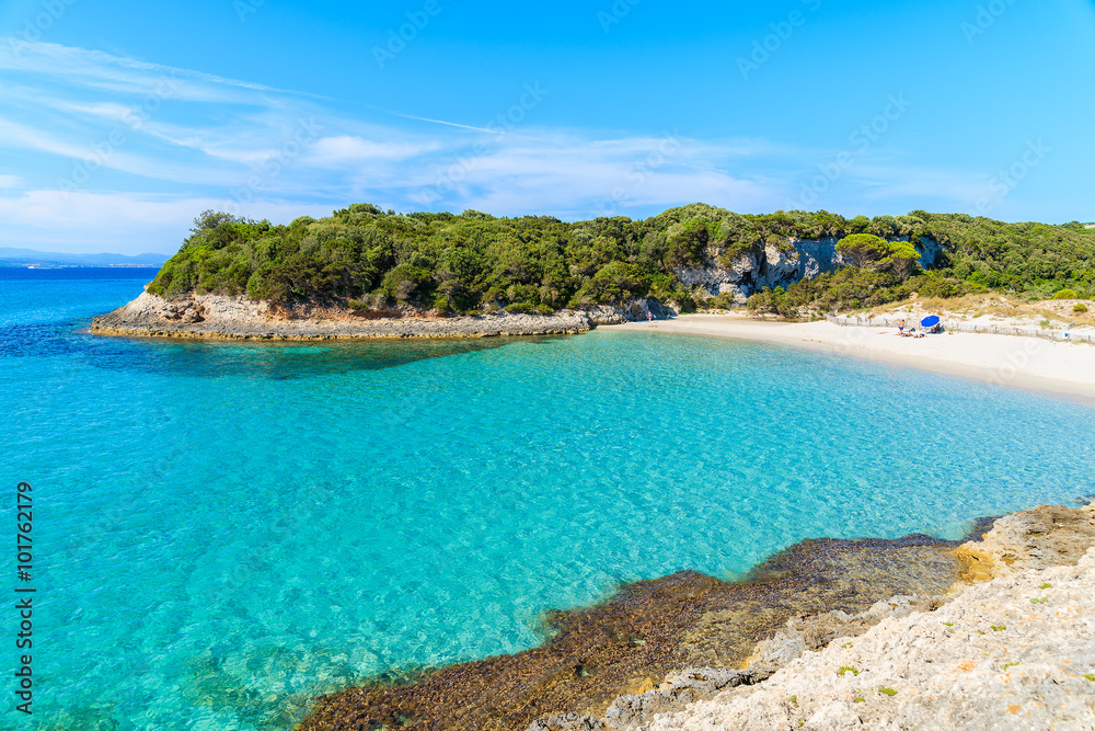 A view of idyllic Petit Sperone beach with crystal clear turquoise sea water, Corsica island, France A view of idyllic Petit Sperone beach with crystal clear turquoise sea water, Corsica island, France