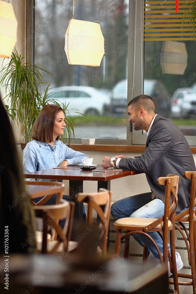 Young couple having a coffee break in a restaurant Young couple having a coffee break in a restaurant