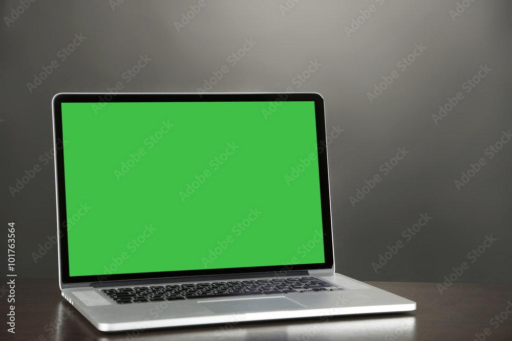 Modern laptop on table, close up Modern laptop on table, close up