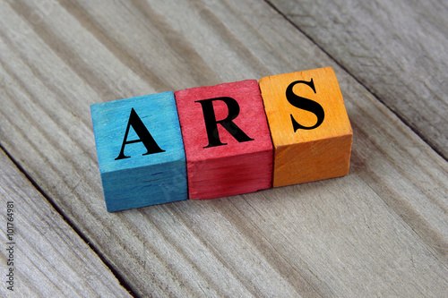 ARS (Argentine Peso) sign on colorful wooden cubes photo