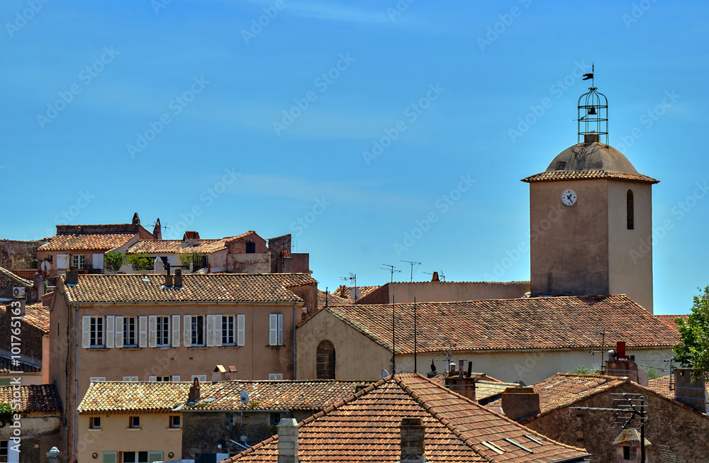 Roofs of houses and the church tower in the south of France.