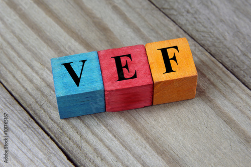 VEF (Venezuelan Bolivar) sign on colorful wooden cubes