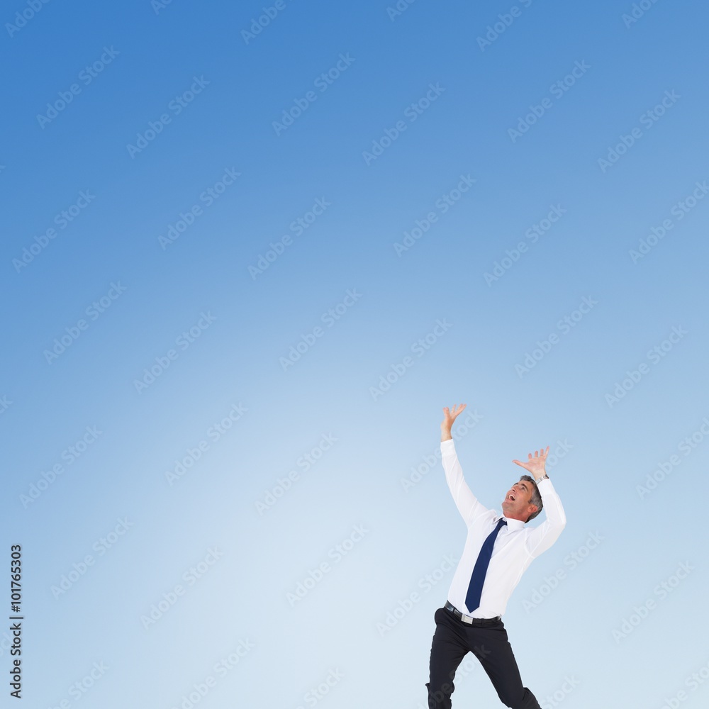 Composite image of businessman with hands raised Composite image of businessman with hands raised