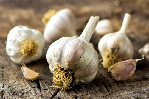 Organic garlic on wooden background