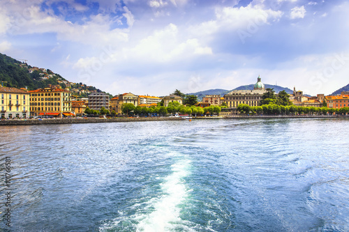 Como city in italian lake district from ferry boat. Italy.