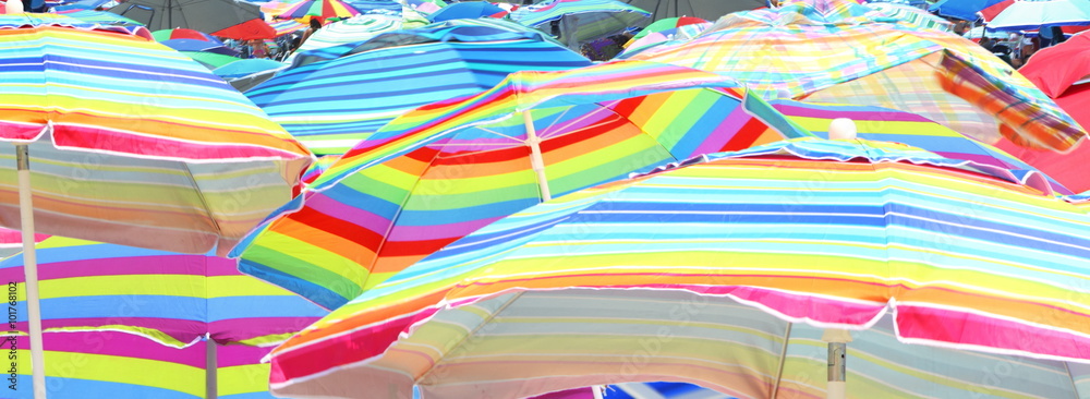 Colorful umbrella closeup on beach
