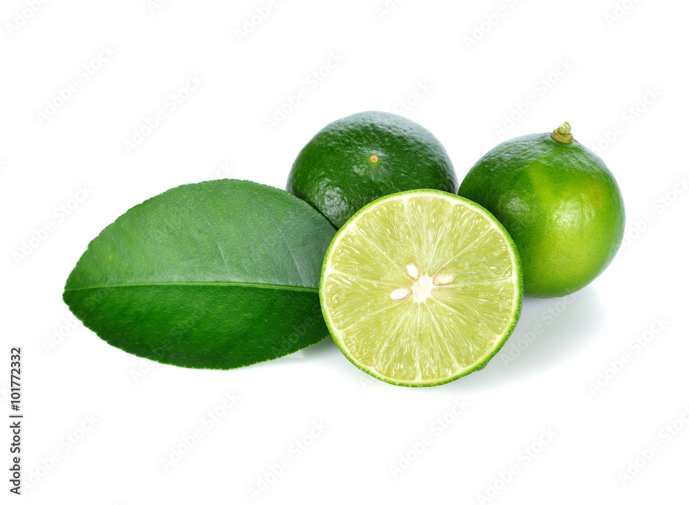Limes with slices and leaves isolated on white background Limes with slices and leaves isolated on white background
