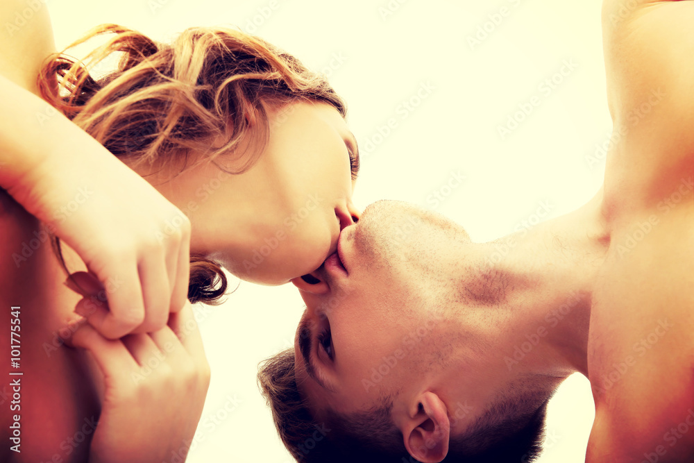 Fotografie Young couple kissing.