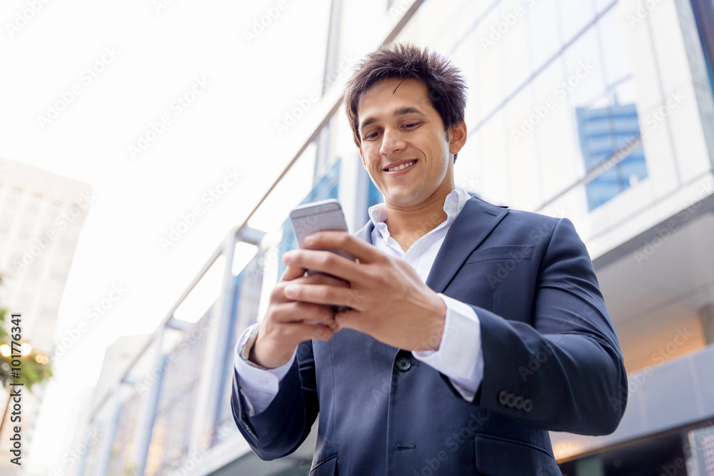 Portrait of confident businessman with mobile phone outdoors Portrait of confident businessman with mobile phone outdoors