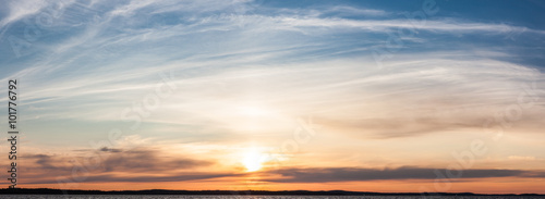 Calm sunset and clouds over lake © Juhku