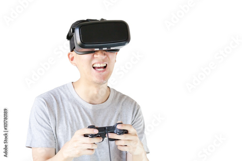 Asian man wearing VR goggle and immersing himself in VR gaming in white isolated