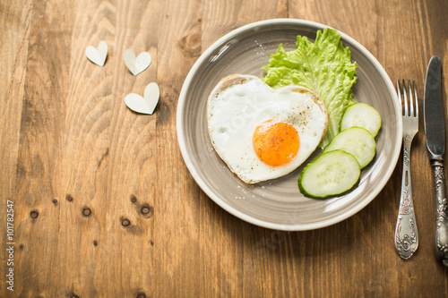 Romantic breakfast with scrambled eggs in Valentine's Day