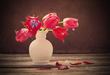 red tulips on old dark background