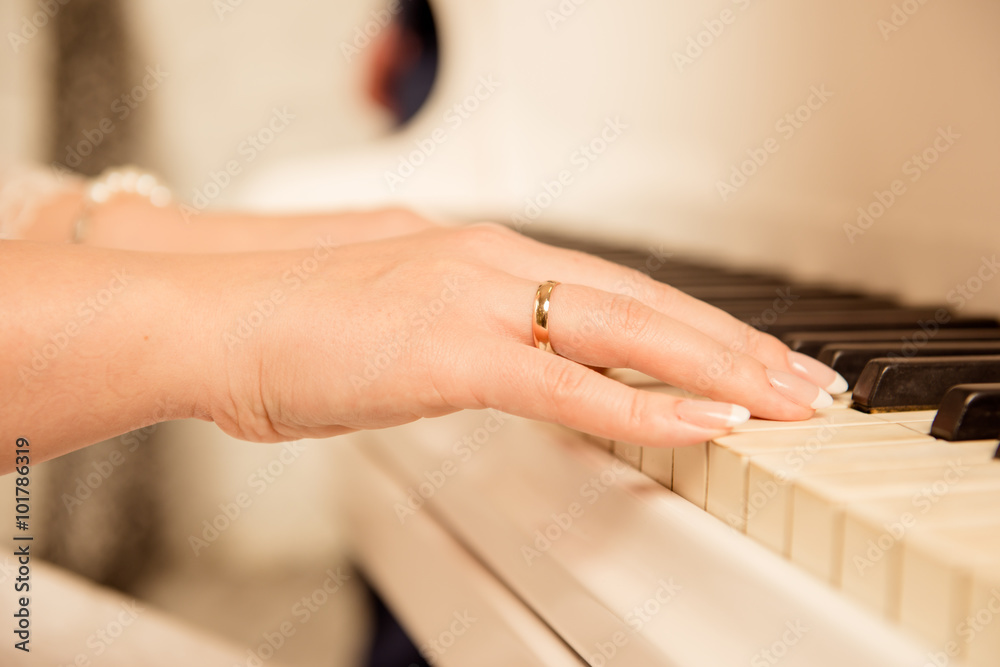 Closeup photo of a female musician playing the piano