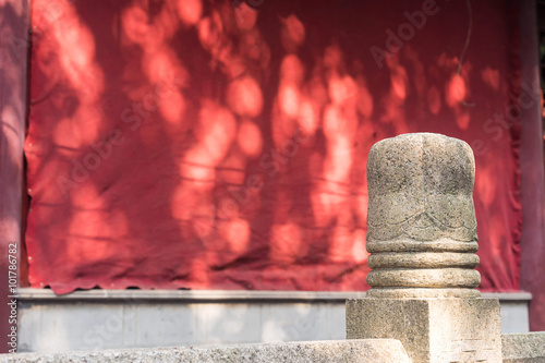 Photography stone fence and red wall