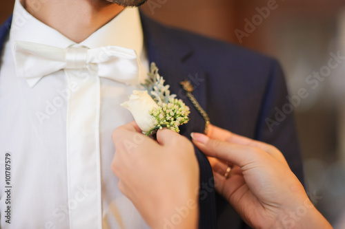 Pinning a Boutonniere