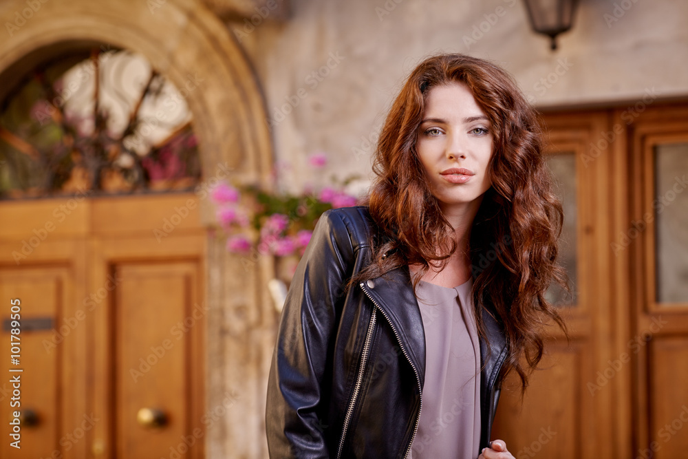 Fashionably jacket woman on the streets of a Italian town Fashionably jacket woman on the streets of a Italian town