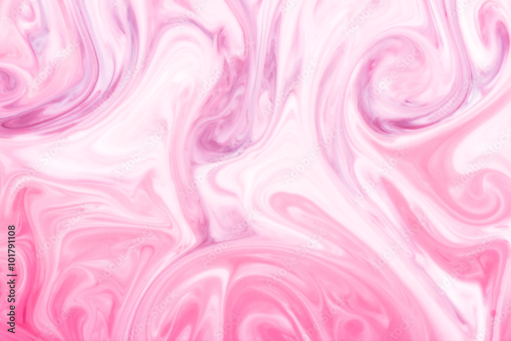 Red and white paint mixing into pink. Red and white paint mixing into pink.