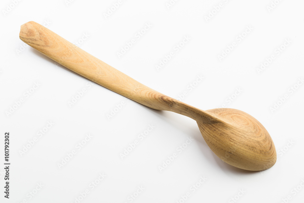 Wooden spoon on white background