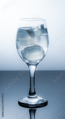 Wineglass with ice cubes