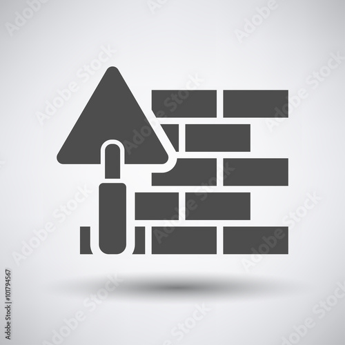 Brick wall with trowel icon