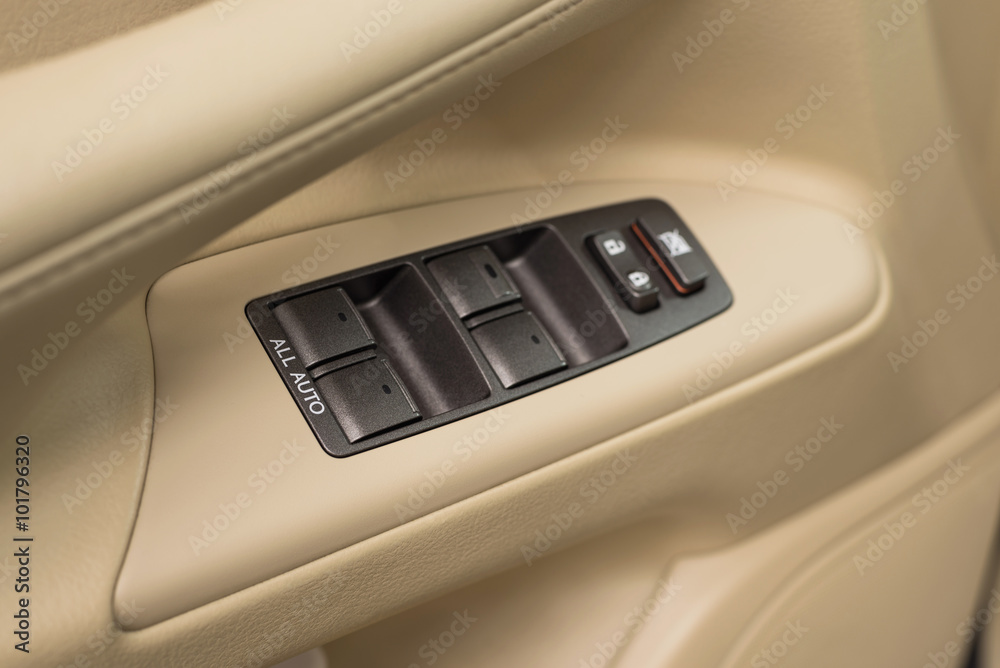 Business car window control buttons. Interior details.