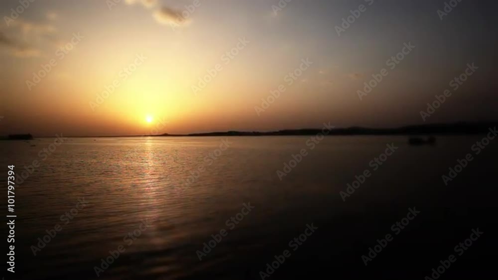 Locked-on shot of a lake at sunset, Bhopal, Madhya Pradesh, India Locked-on shot of a lake at sunset, Bhopal, Madhya Pradesh, India