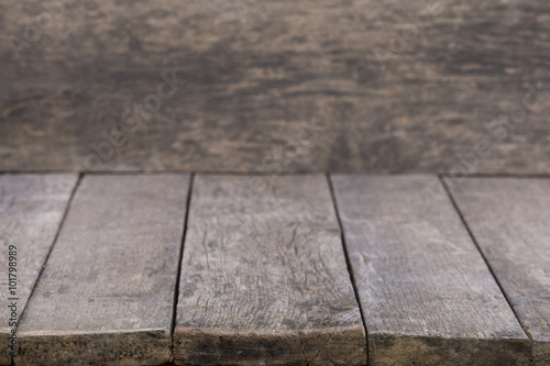 Wooden table on defocuced with curtain background
