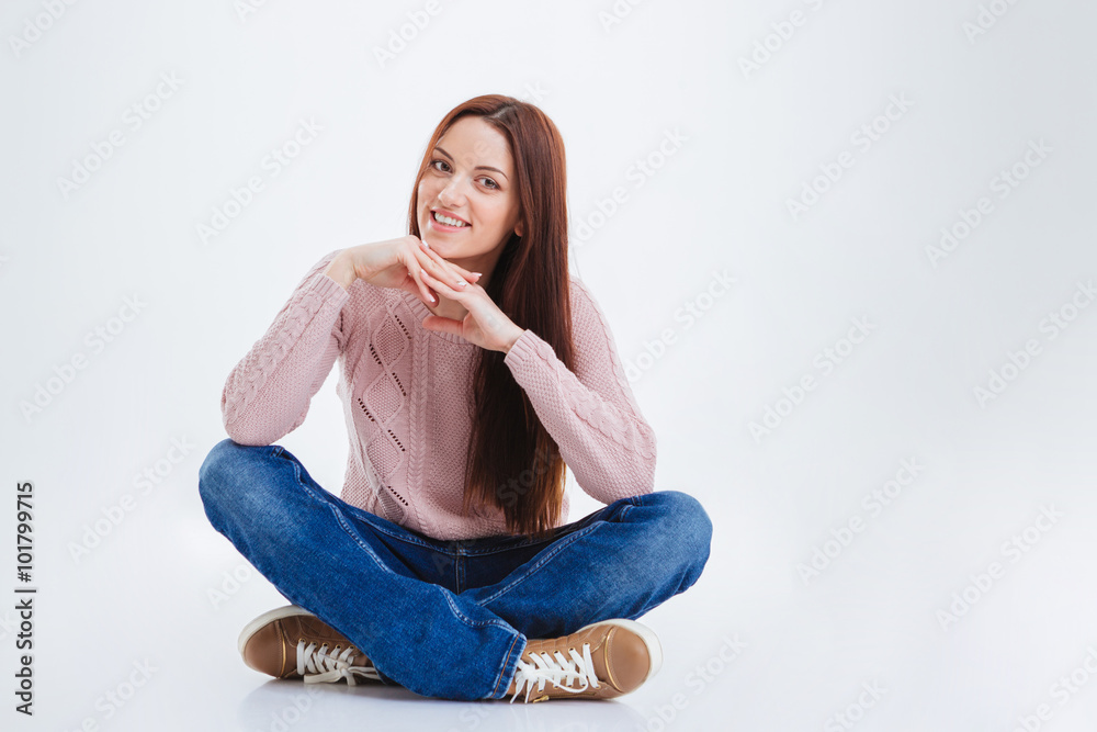 Happy woman sitting on the floor Happy woman sitting on the floor
