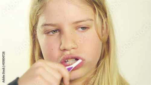 Girl brushing her teeth
