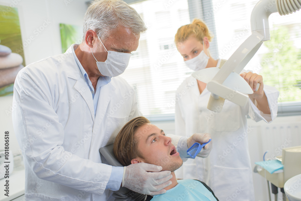 Young man having dental treatment Young man having dental treatment