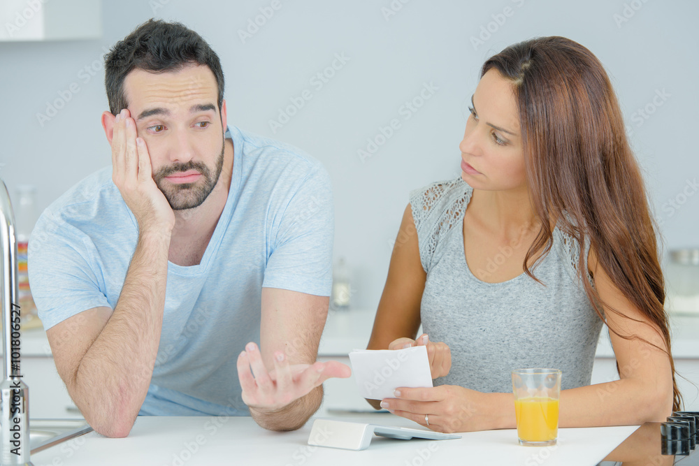Couple arguing in the kitchen Couple arguing in the kitchen