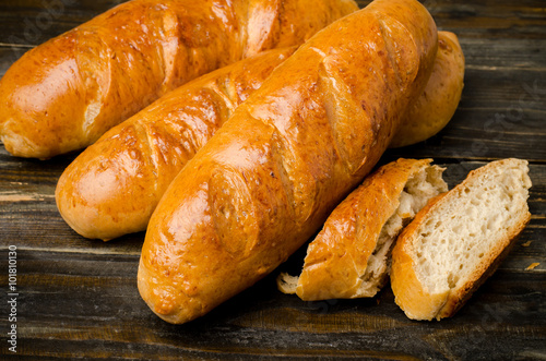 Fresh bread on wooden background