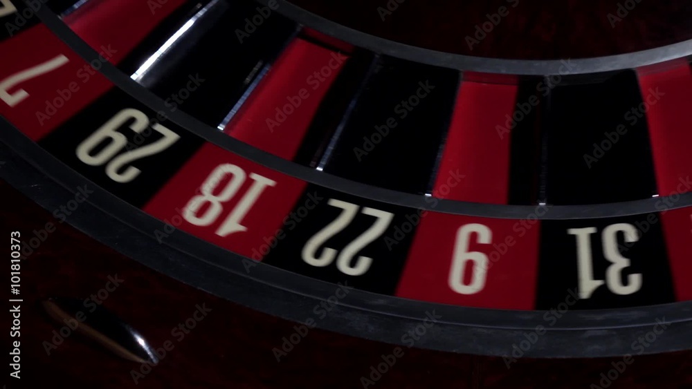 Usual roulette wheel running with white ball, top view Usual roulette wheel running with white ball, top view