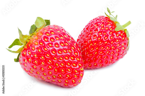 Two juicy and ripe strawberries close up isolated over white.