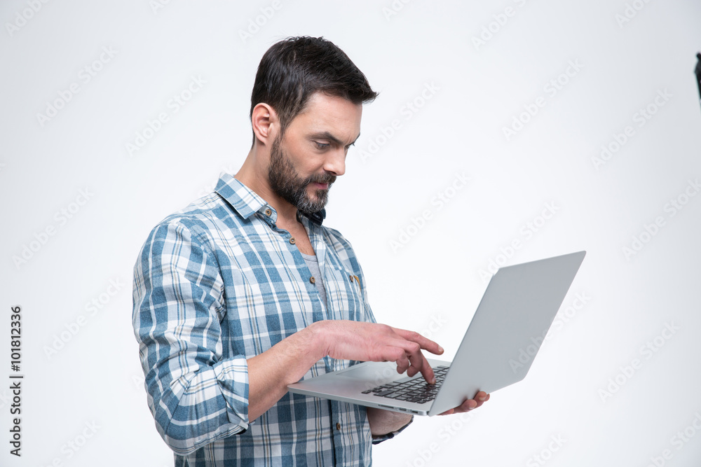 Casual man using laptop computer Casual man using laptop computer