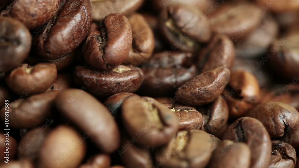 Roasted Coffee Beans on a Table Rotating. Close-up Roasted Coffee Beans on a Table Rotating. Close-up