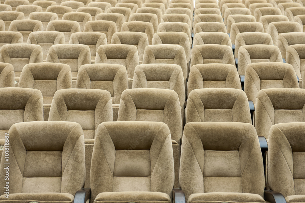 Obraz premium Empty auditorium with beige chairs, theatre or conference hall