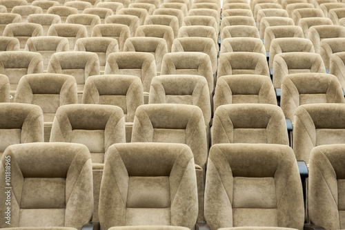 Empty auditorium with beige chairs  theatre or conference hall
