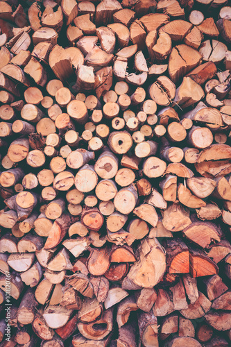 Stack of firewood  wood background texture. Layer of stored cut