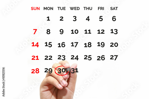 Red circle. Businessman mark on the calendar at 30