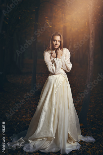 Victorian dressed woman in magical forest